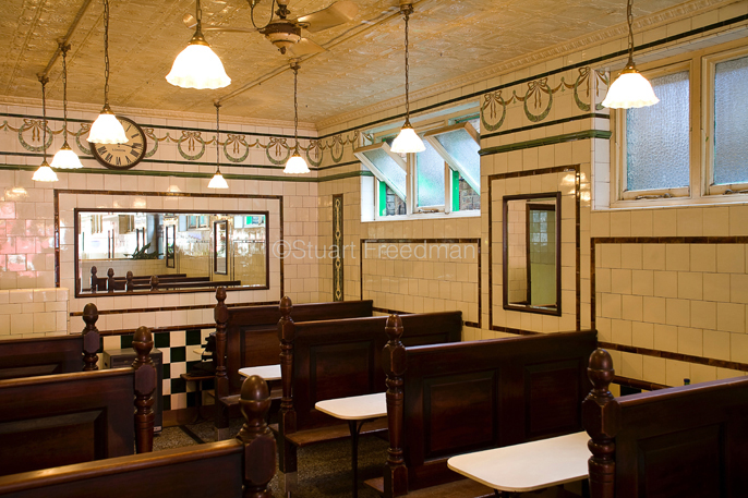 UK - London - The interior (including the painted tin tiles on the ceiling) of Manze's Eel, Pie and Mash shop in Walthamstow,